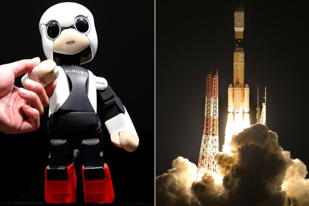 Kirobo the robot before heading into space. A cargo-carrying rocket blasts off for its mission. Photos: Reuters, AP