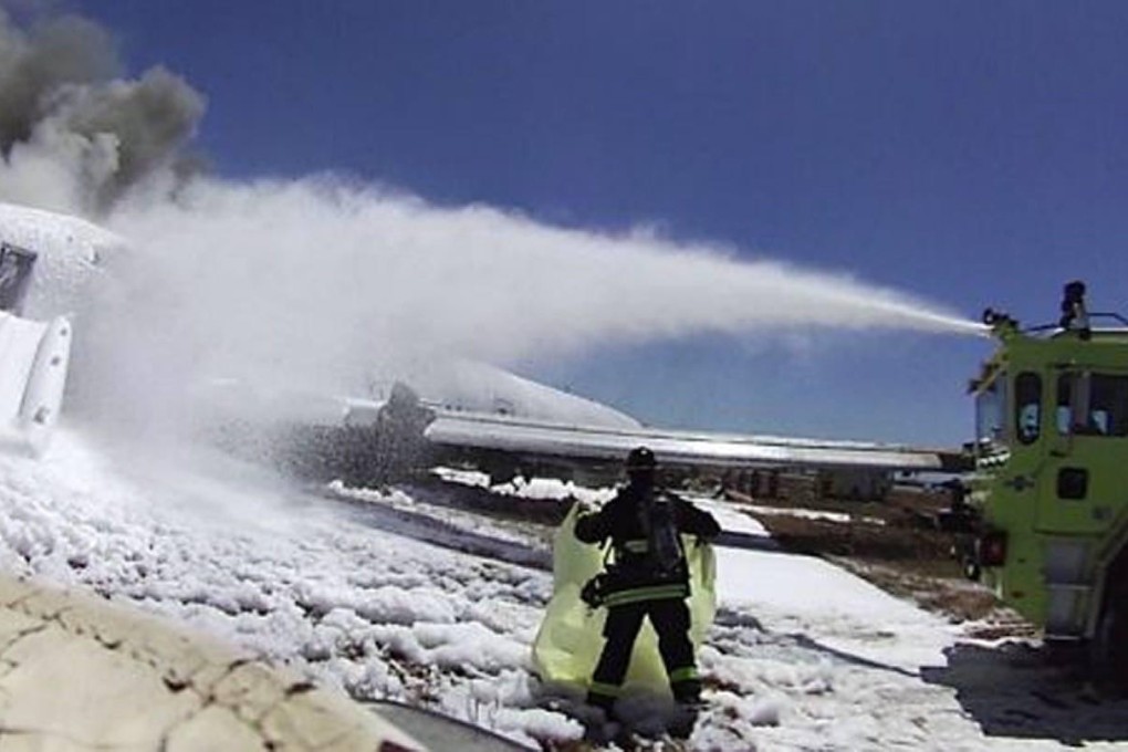 A firemen covers the body of Ye Mengyuan in an image from a helmet-mounted video camera. Photo: San Francisco Chronicle