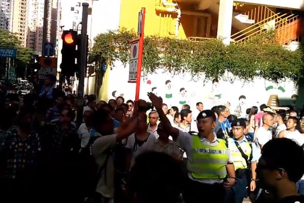 A YouTube video grab of an officer allegedly swearing at protesters during Sunday's pro-police rally in Mong Kok. Photo: SCMP Pictures
