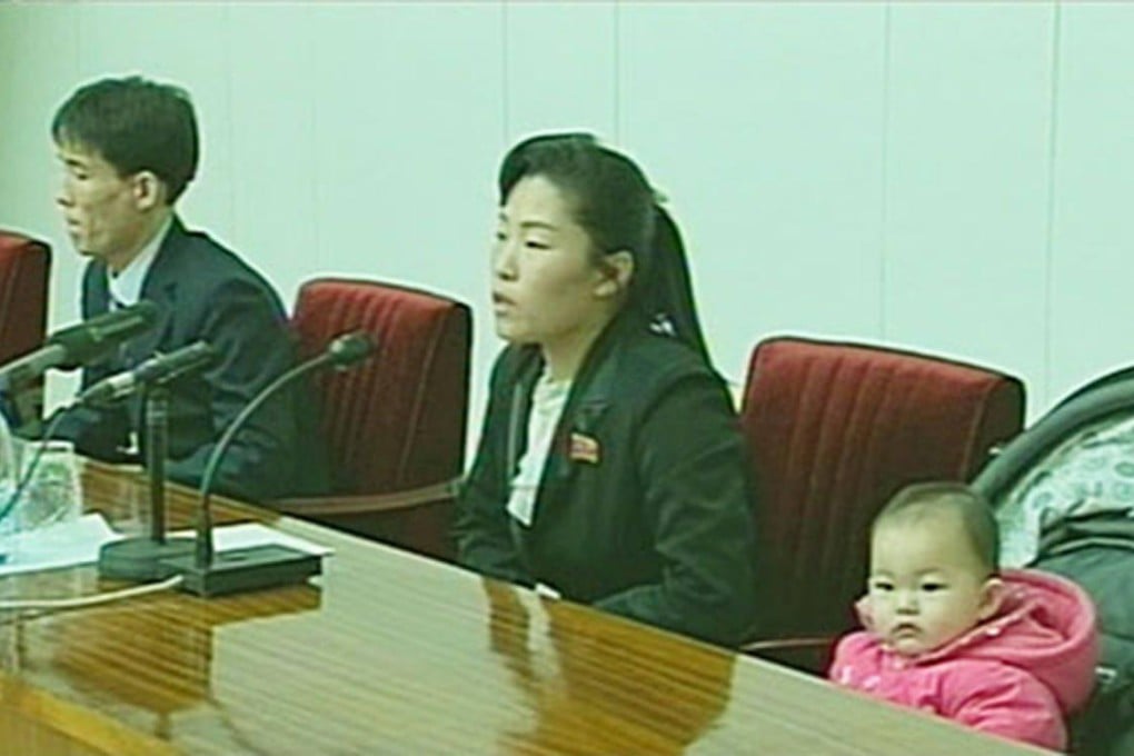 Kim Kwang-ho (left), his wife and daughter appear on TV