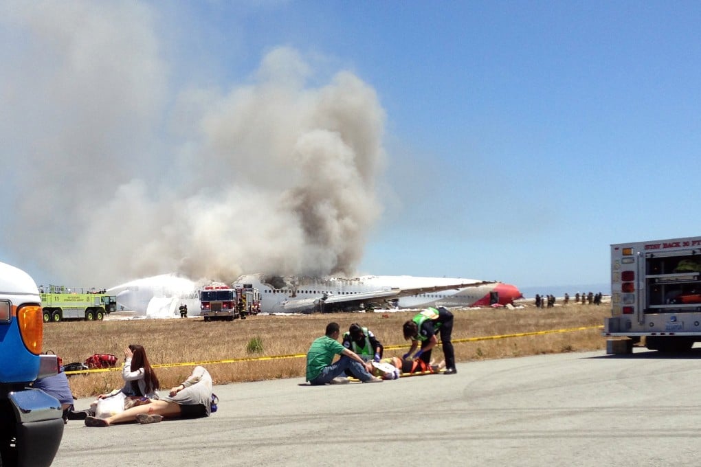 US authorities are investigating how a 16-year-old passenger who had survived the initial crash-landing died on the runway. Photo: AP