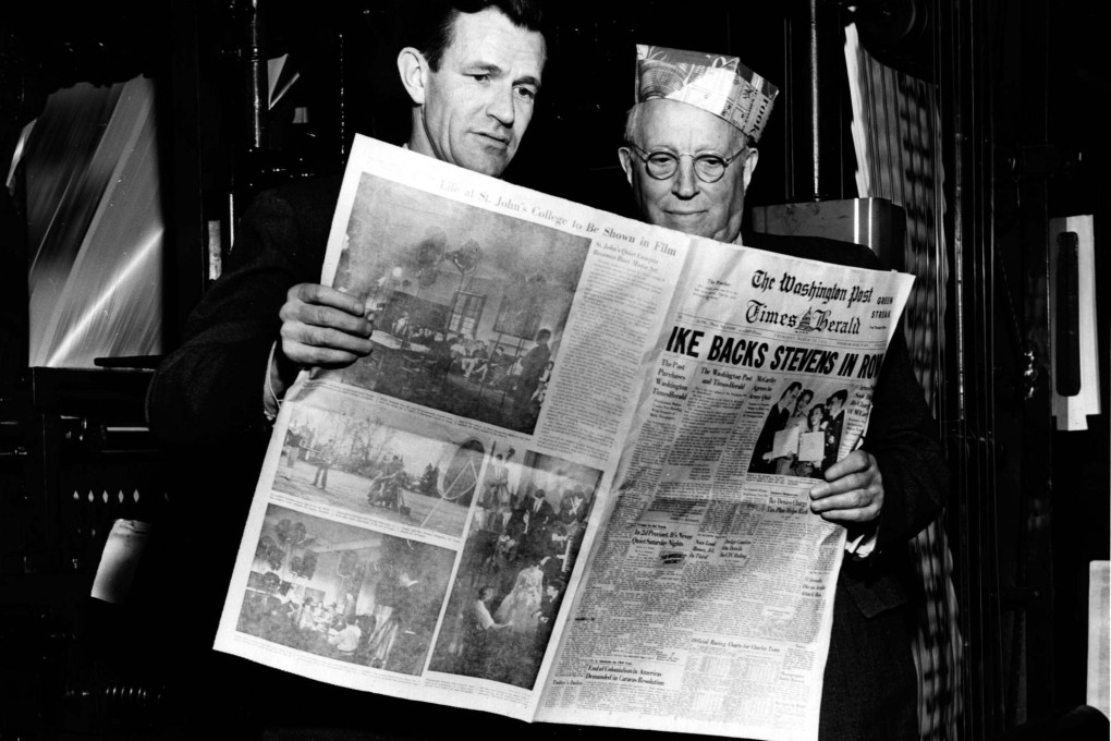 Philip Graham and Eugene Meyer look at the first edition ofThe Washington Post Times Herald in 1954. Photo: AP