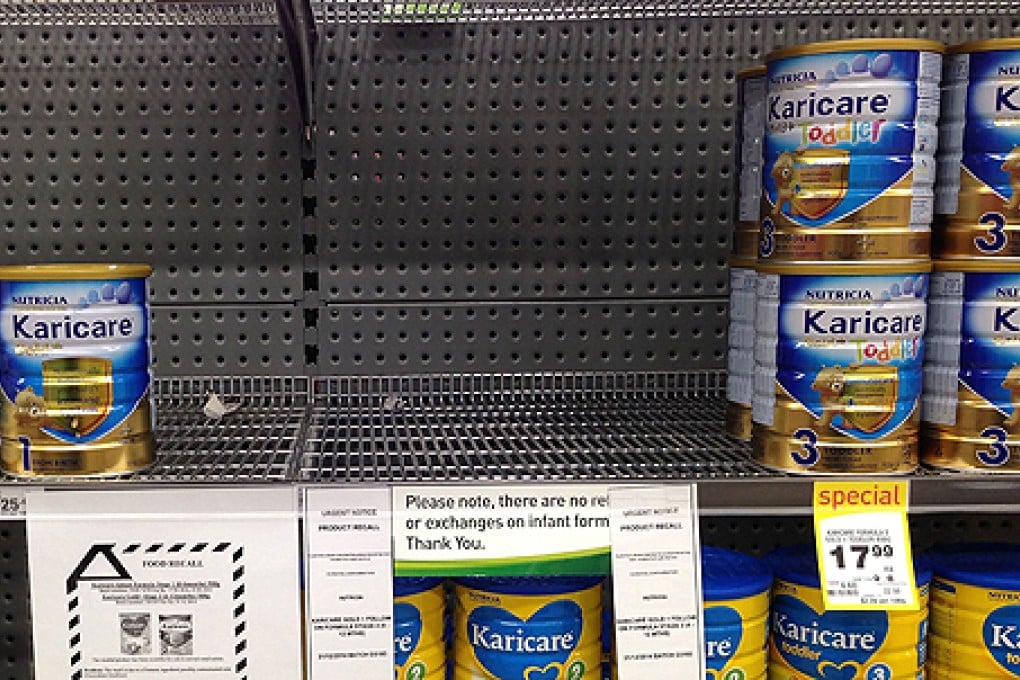 Shelves in a Wellington supermarket have been stripped clear because of suspected contamination of a Fonterra product. Photo: AFP