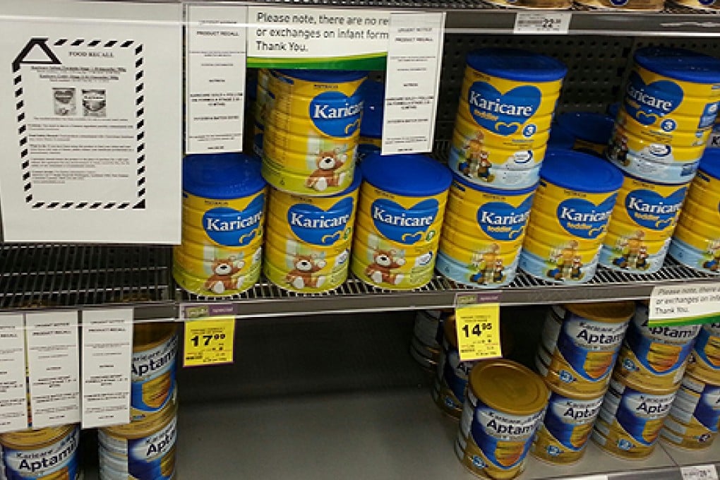 A recall notice for Karicare Gold+ Follow On Formula Stage 2 and other baby formula seen on a supermarket shelf in Wellington, New Zealand, last  Sunday. Photo: Xinhua