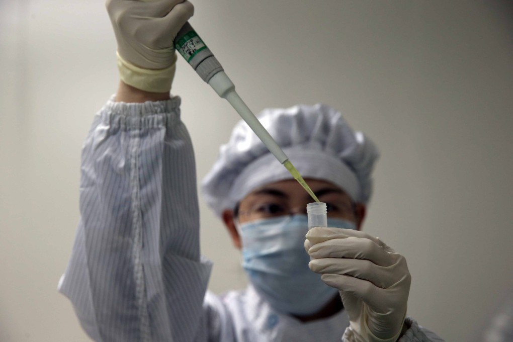 A lab technician tests for the H7N9 virus. Photo: EPA
