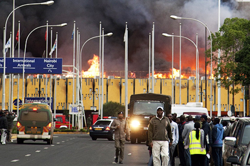 Black smoke billows from Jomo Kenyatta International Airport in Nairobi. Photo: AP