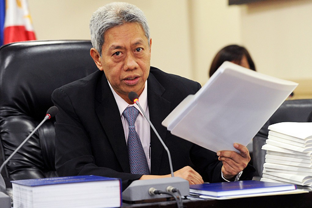 Philippine Justice Department investigating chief Nonnatus Rojas answers questions at a press conference in Manila. Photo: AFP