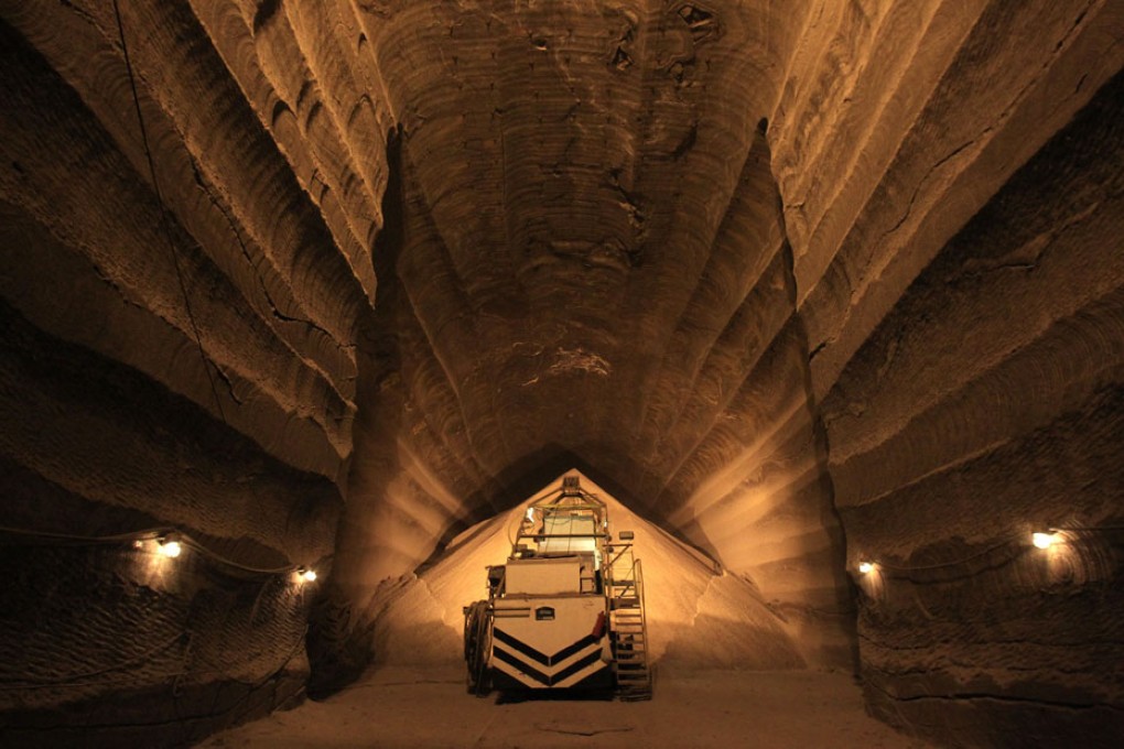A miner operates machinery in a potassium mine owned by Russia's Uralkali company. Photo: Reuters