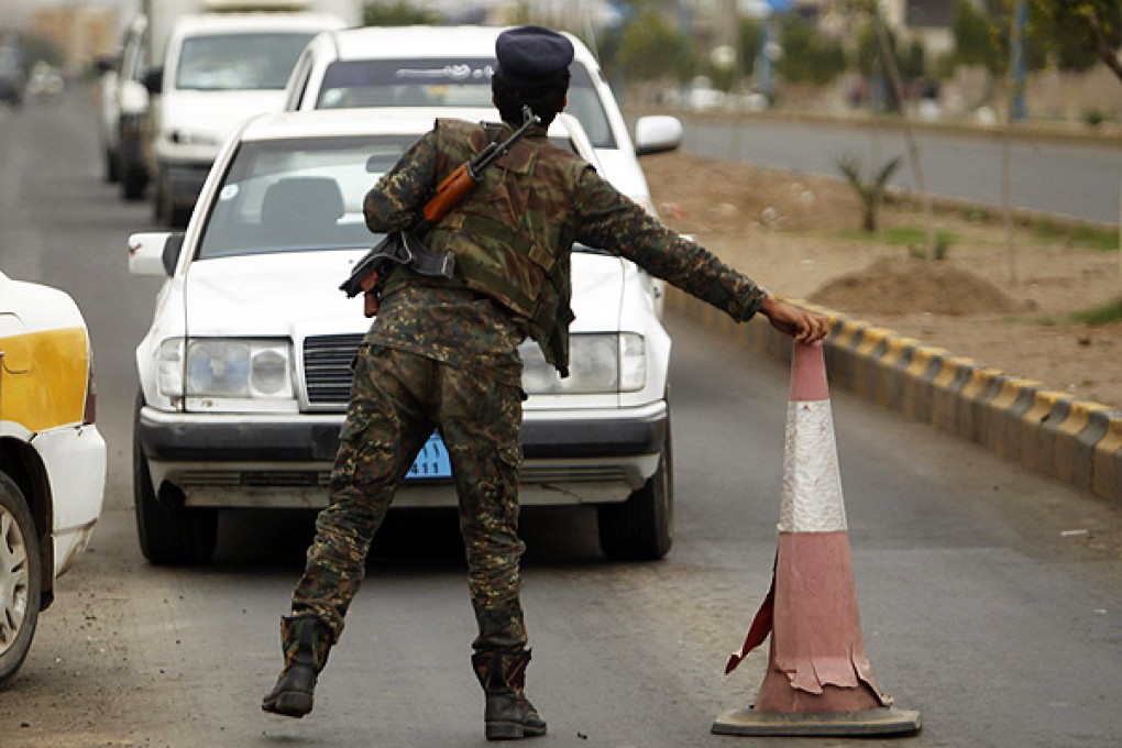 Yemeni security forces man a checkpoint in Sanaa. Photo: Reuters