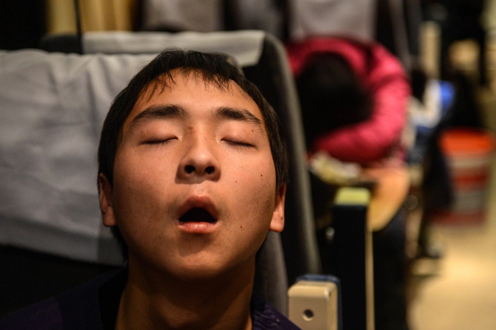 This passenger has no trouble sleeping on a train. But not so for the 40 per cent of Chinese afflicted by sleep disorders. Photo: Xinhua
