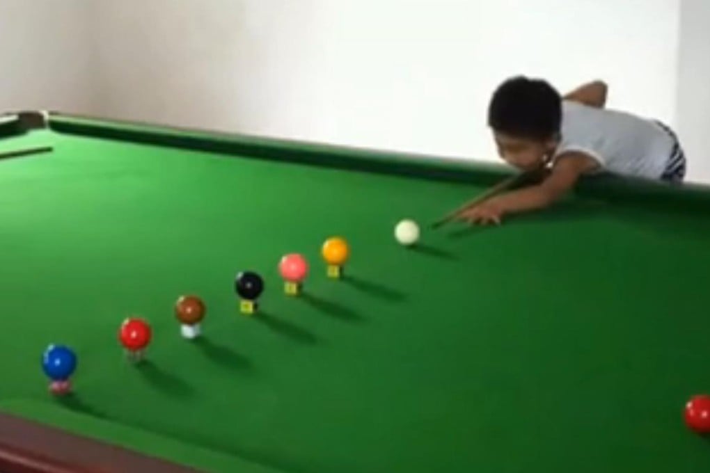 A screen grab of the viral video shows Wang Wuka playing a trick shot on a snooker table. Photo: SCMP Pictures