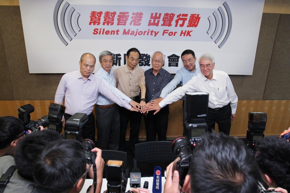The six convenors of Silent Majority for Hong Kong at the group's launch yesterday (from left): Spencer Li, Peter Wong, Ho Lok-sang, Chang Chak-yan, Fung Ka-pun and broadcaster Robert Chow Yung, who said they would welcome a discussion with Occupy Central. Photo : Nora Tam