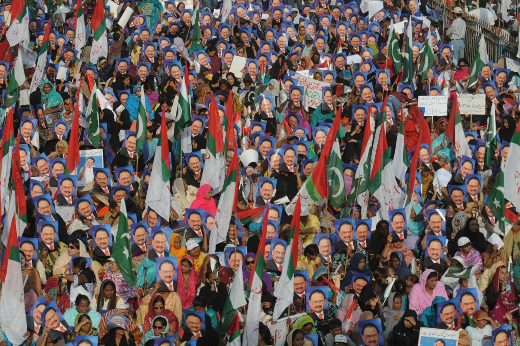 Supporters of the Muttahida Qaumi Movement carry pictures of its leader Altaf Hussain during a rally in Karachi in October 2011. Photos: AFP