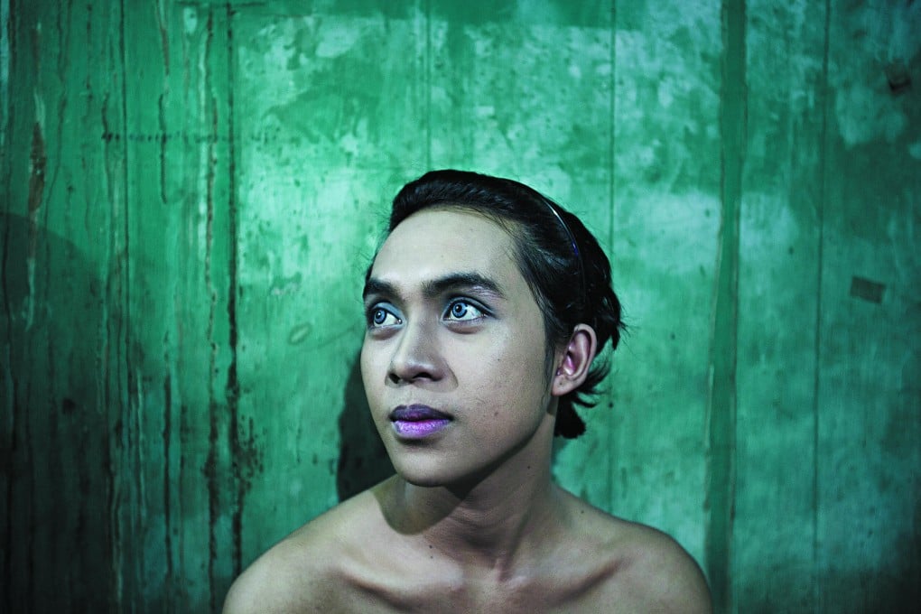 Shinta, in her bedroom at Mami Joyce's brothel cum commune near Taman Lawang, Jakarta.