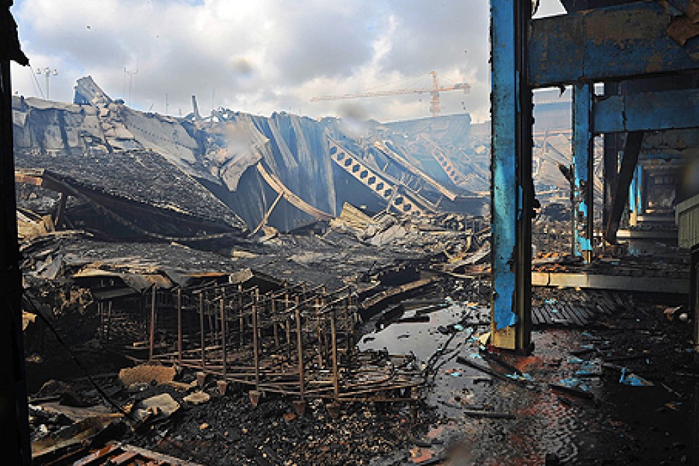 The remains of the international arrivals lounge on Thursday can be seen after an inferno ripped through Jomo Kenyatta International Airport in Nairobi on Wednesday. Photo: AFP