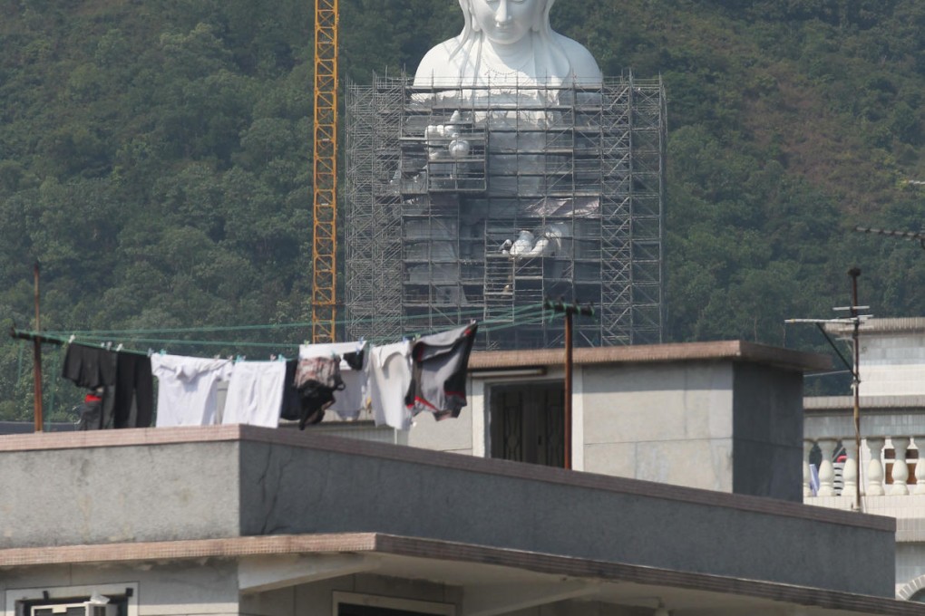 Construction work on a Goddess of Mercy statue. Photo: Nora Tam