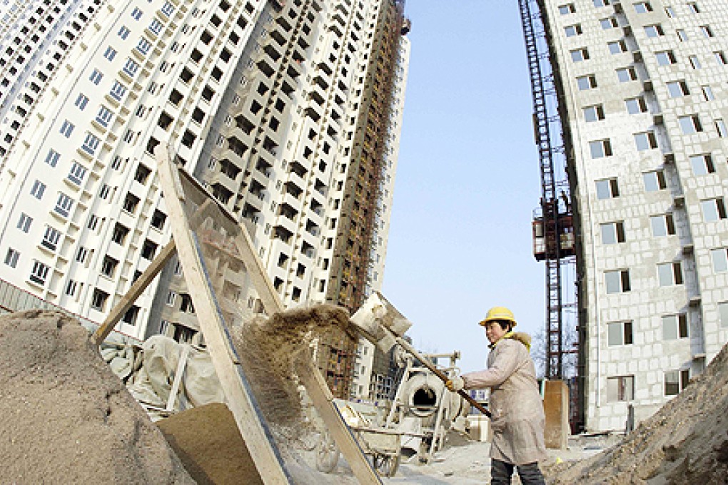 As part of efforts to bring down home prices, the government plans to build 36 million units by 2015 to cater to the lower income group. Photo: Reuters