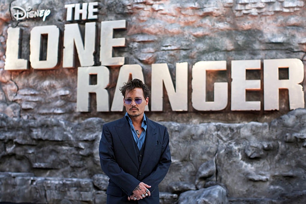 Johnny Depp poses on the red carpet before the British premiere of 'The Lone Ranger' in London. Photo: AFP
