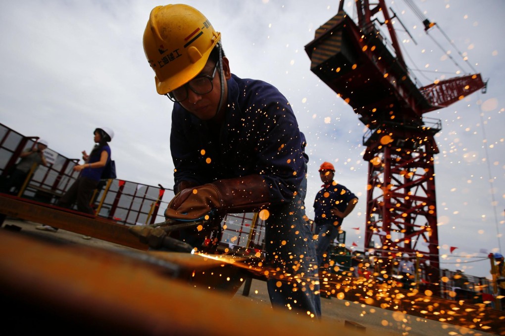 Construction work in Shanghai. One of the thorniest issues facing policymakers is who pays for urbanisation. Photo: Reuters