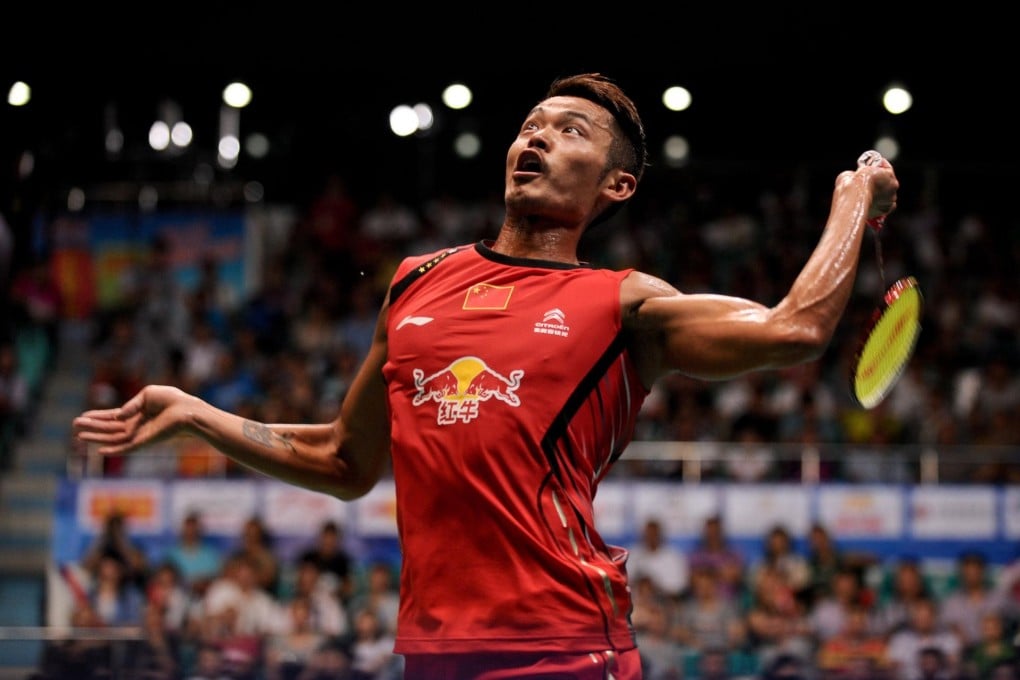 Lin Dan slams a return against Vietnam's Nguyen Tien Minh during their men's singles semi-final in Guangzhou. Photo: AFP