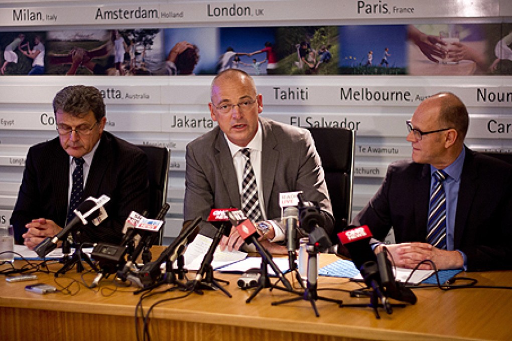 Fonterra chief executive Theo Spierings (centre) with head of New Zealand Milk Products Gary Romano (left) and Kerry Underhill, head of communications in Auckland, New Zealand. Photo: AP