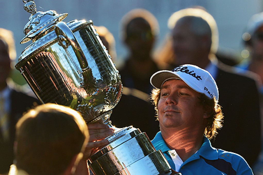 Jason Dufner admires the Wanamaker Trophy after winning the 95th PGA Championship on Sunday. Photo: AFP