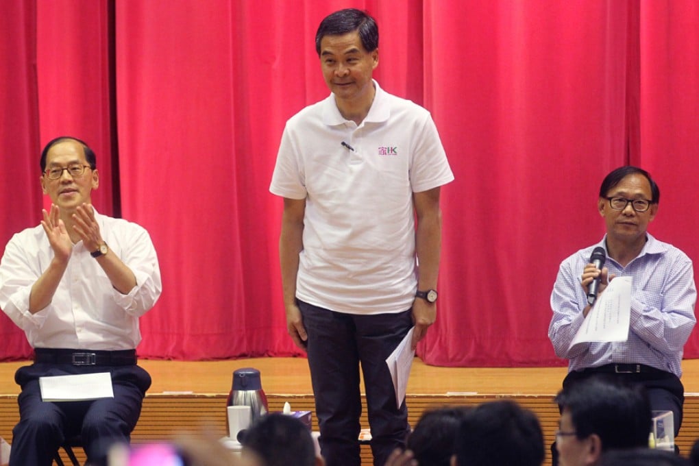 (Left to right) The Secretary for Home Affairs Tsang Tak-sing, Chief Executive Leung Chun-ying and chairman of Yuen Long District Council Leung Che-cheung attend the public forum at Tin Ching Community Hall. Photo: K.Y. Cheng