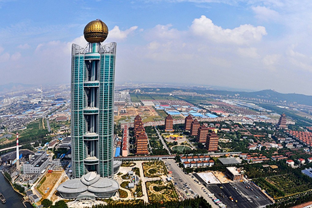 The Longxi International Hotel towers above Huaxi, which is still classed as a village in east China's Jiangsu province. Photo: AFP