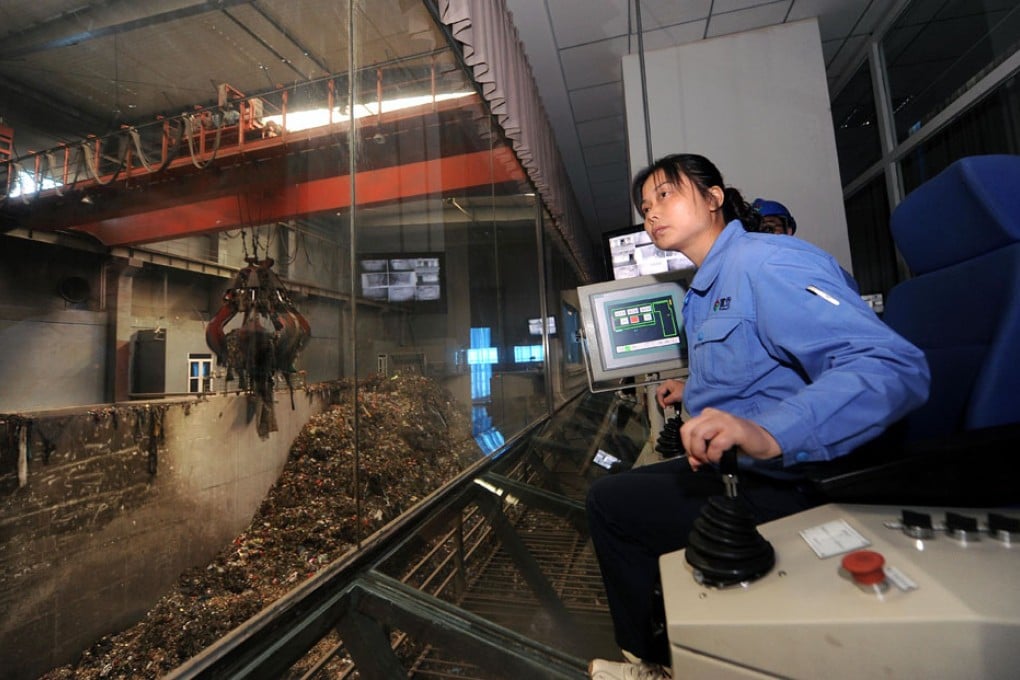A woman works in an incinerator in Shanxi. Photo: Xinhua