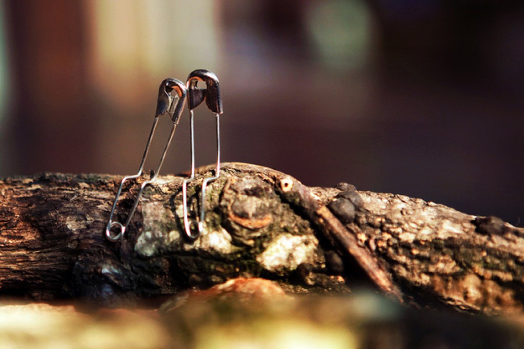 Anthropomorphic safety pins fall in love. Photo: Jun.C