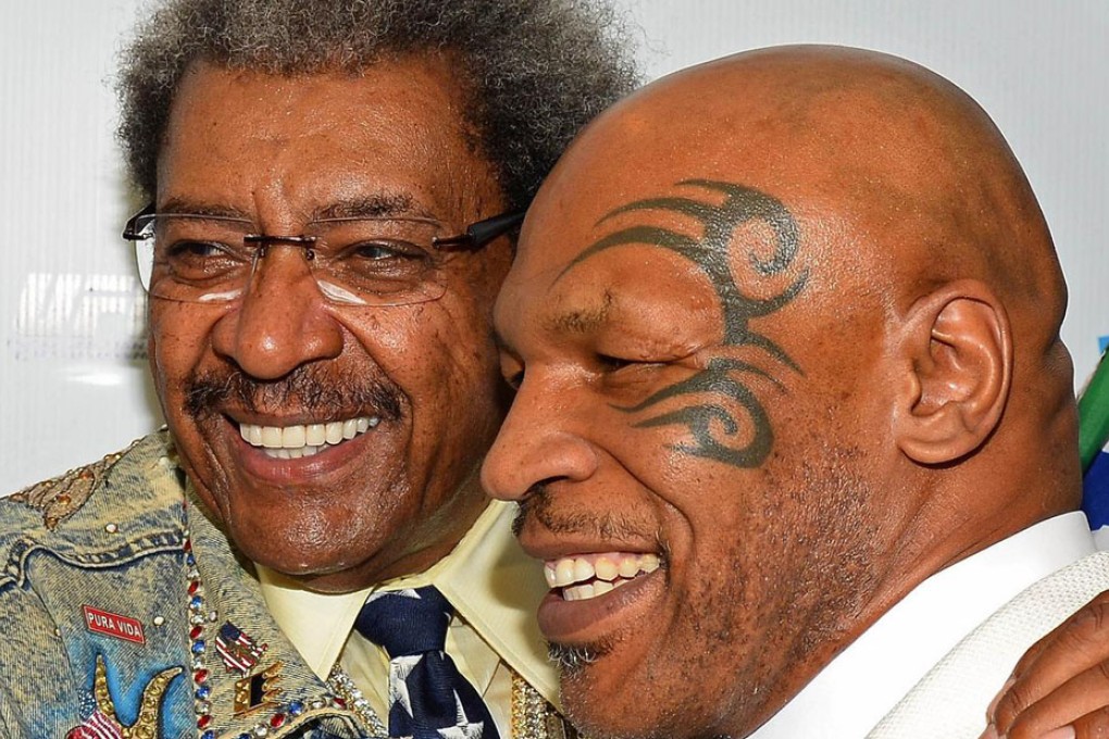 Legendary promoter Don King and Mike Tyson put past differences aside at the Hall of Fame extravaganza in Las Vegas, where Larry Holmes was also among the inaugural inductees. Photo: AFP