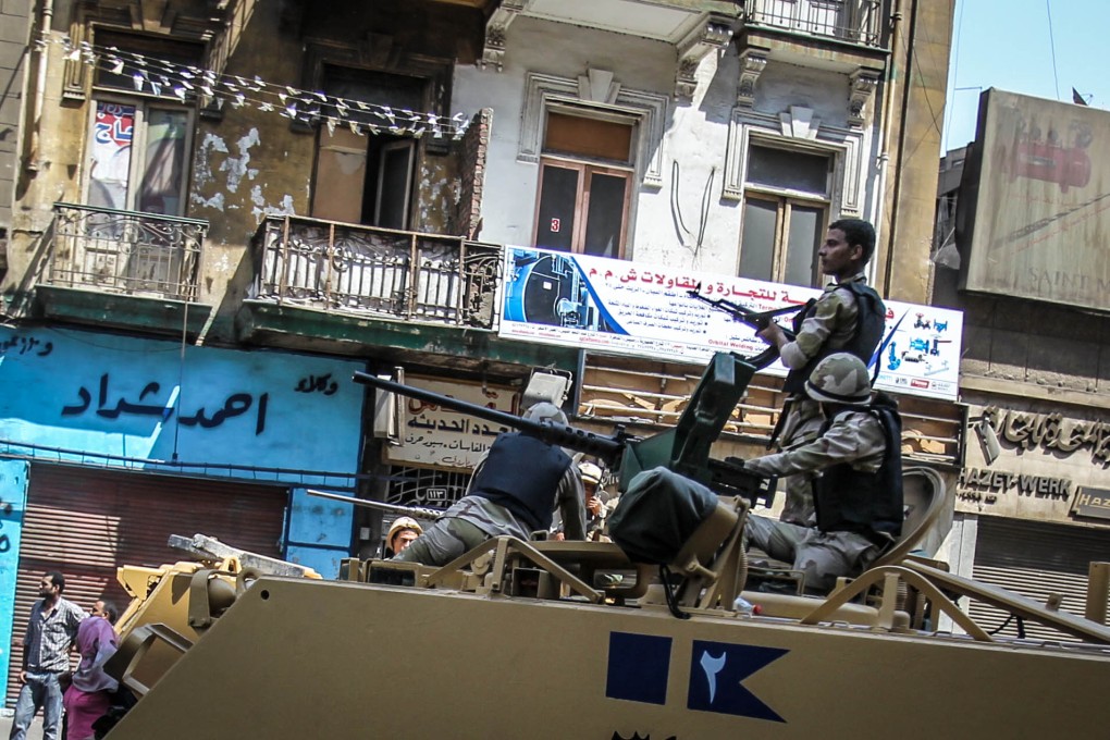 Soldiers are seen during clashes in Ramses Square, Cairo. Photo: Xinhua