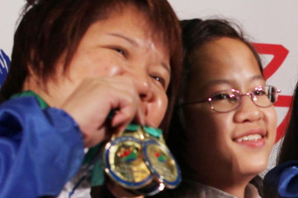 Triple gold winner So Tsz-ling with her mum Penny. Photo: Nora Tam