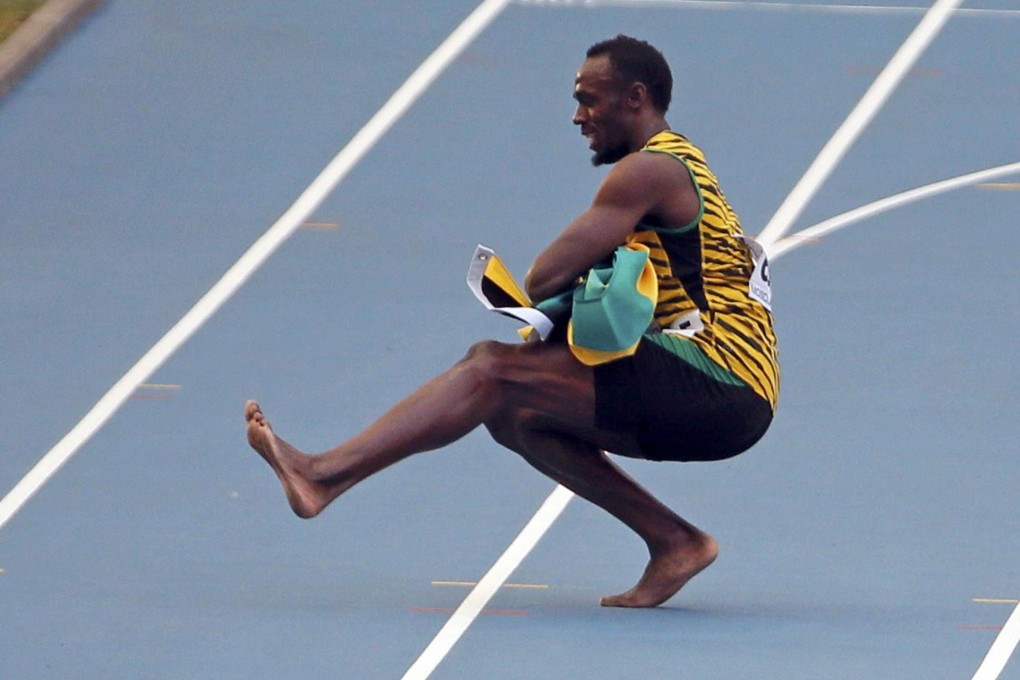 Jamaican great Usain Bolt performs his version of a traditional Russian dance after his relay win in Moscow yesterday. Photo: Reuters