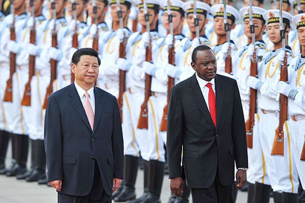 Chinese President Xi Jinping and Kenya's President Uhuru Kenyatta inspect Chinese honour guards during a welcoming ceremony outside the Great Hall of the People in Beijing on Monday. Photo: AFP