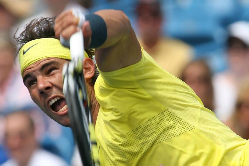 Rafael Nadal serves during his hard-fought win over American John Isner in Cincinnati. Photo: EPA