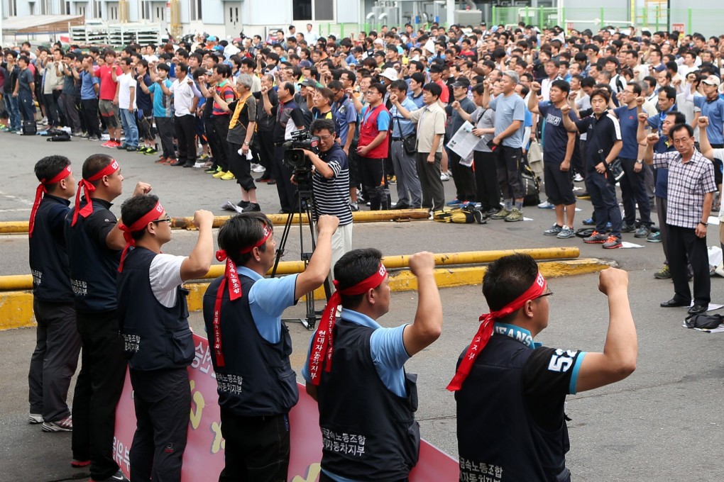 Workers from Hyundai Motor's labour union shout slogans during a partial strike at the company's main factory in Ulsan, southeast of Seoul, on Wednesday. Photo: AFP