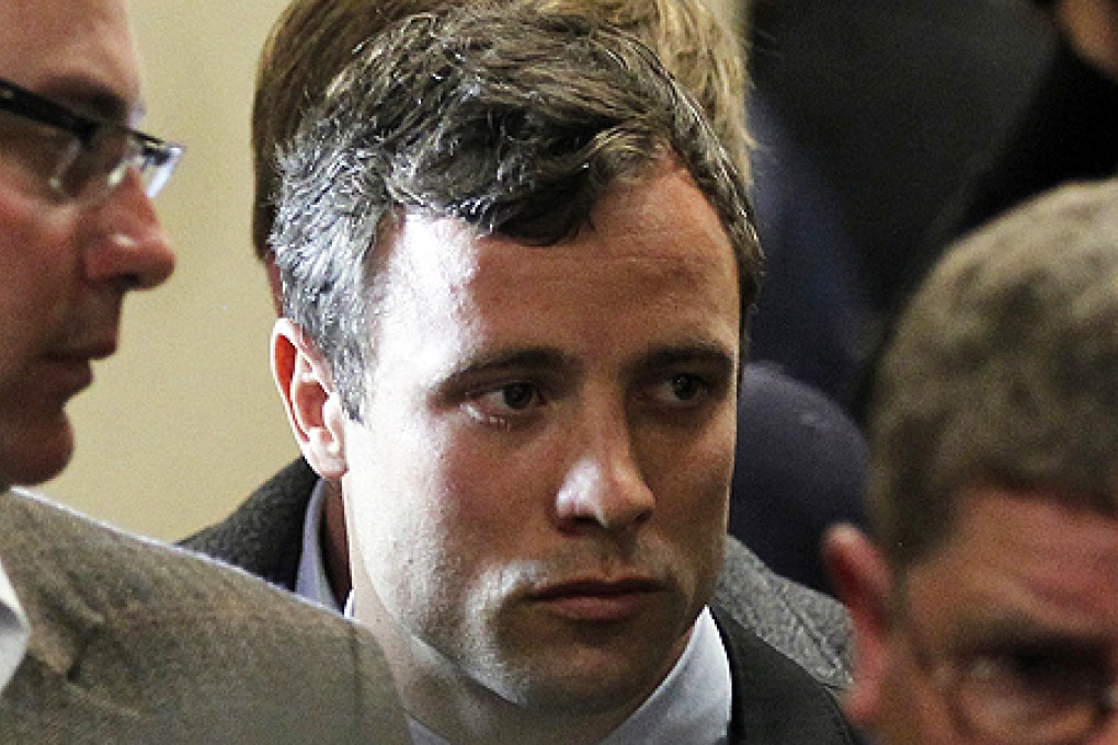 Olympic and Paralympic running star Oscar Pistorius leaves after his court appearance at the Pretoria Magistrates court, on Monday. Photo: Reuters