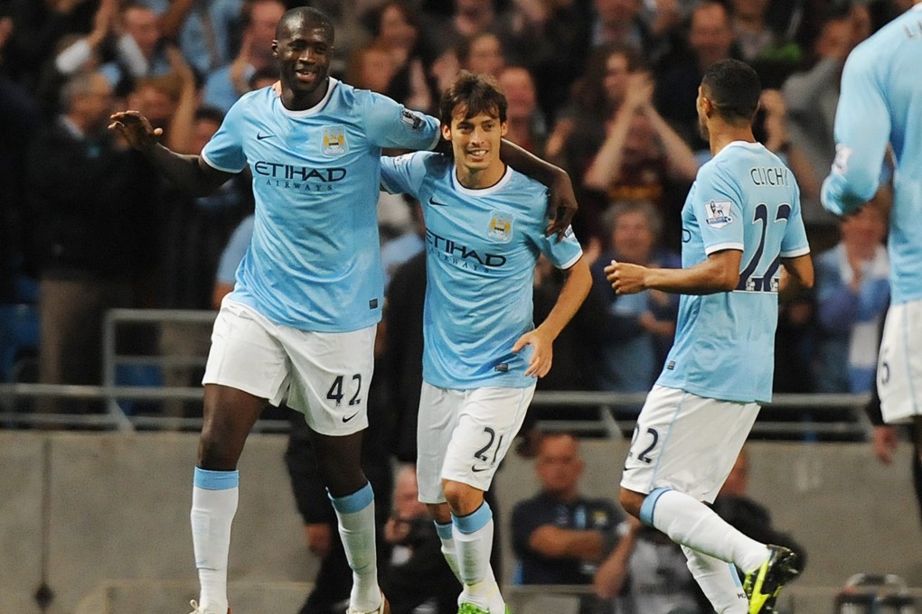 Manchester City's Yaya Toure (left) and teammate David Silva (centre) during the English Premier League match between Manchester City and Newcastle United. Photo: EPA