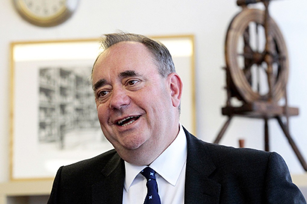 Alex Salmond, Scotland's leader of the Scottish National Party and first minister, visits the Barrie Knitwear factory in Hawick, Scotland, on Tuesday. Photo: AFP