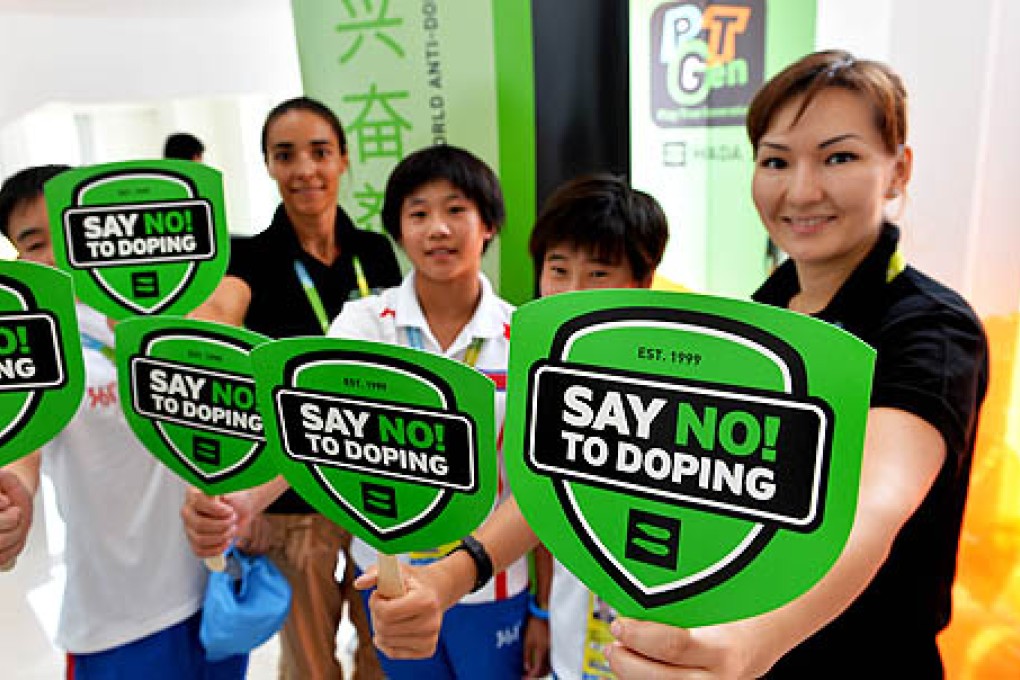 Athletes and staff of World Anti-Doping Agency attend an anti-doping campaign at the 2013 Asian Youth Games in Nanjing, capital of east China's Jiangsu province, on Saturday. Photo: Xinhua