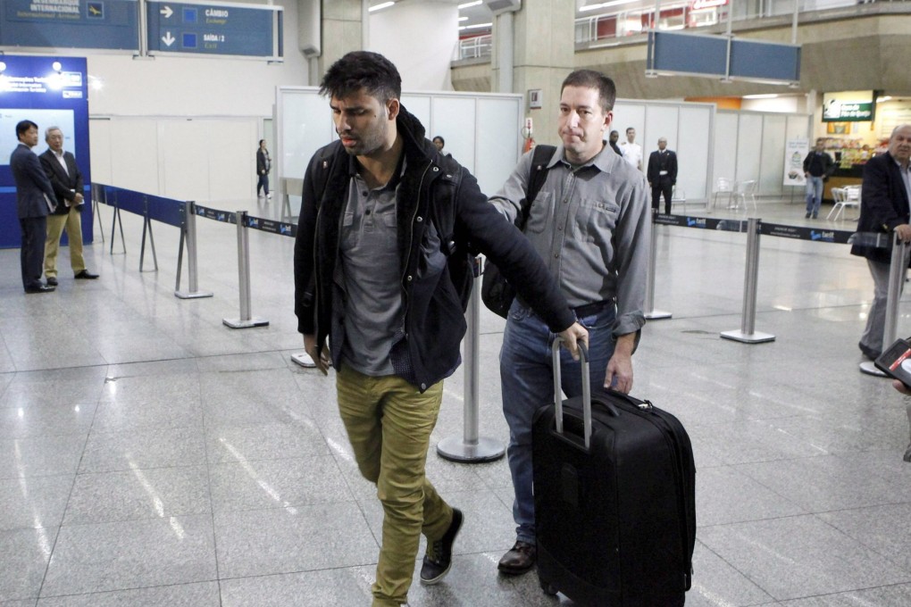 David Miranda and Glenn Greenwald arrive in Galeao Tom Jobim airport in Rio de Janeiro. Photo: EPA