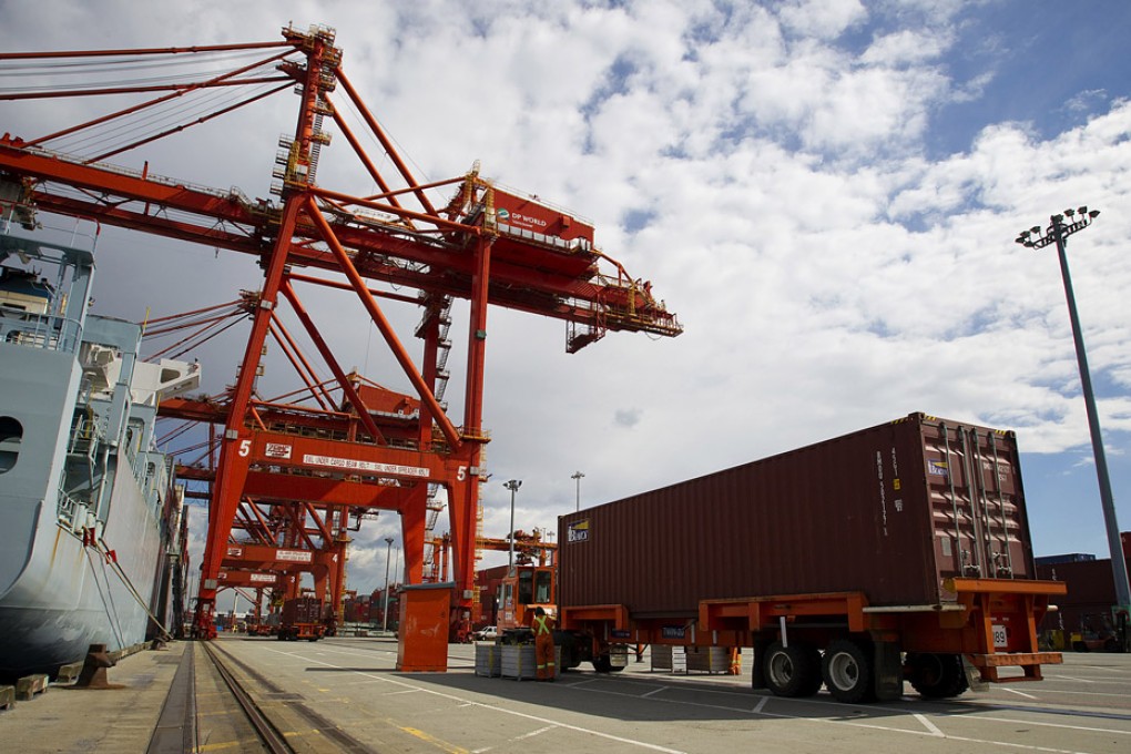 A COSCO Pacific Ltd. cargo ship unloads a freight container at the Port Metro Vancouver terminal. Photo: Bloomberg