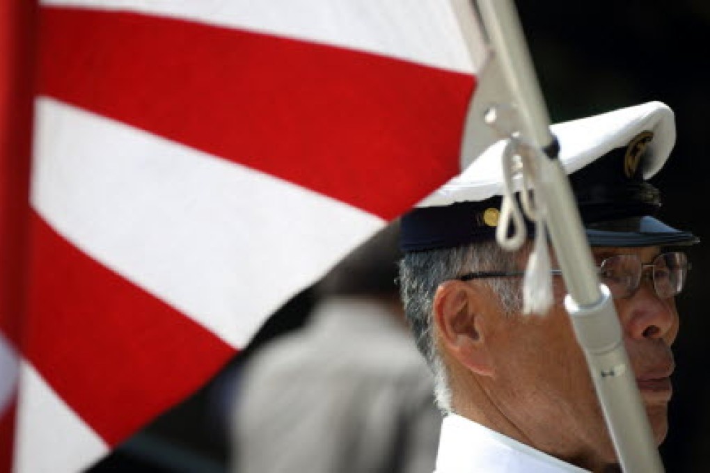 A man visits Yasukuni Shrine on the anniversary of Japan's surrender in WWII. Photo: Bloomberg