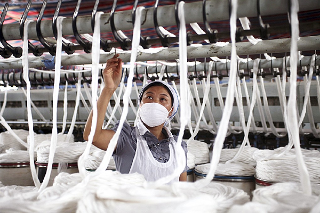 An employee works at a garment factory in Quanzhou. Photo: Reuters