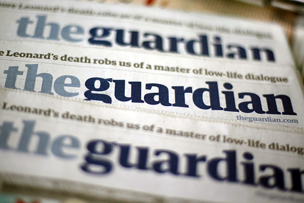 Copies of the Guardian on sale in London. Photo: Reuters