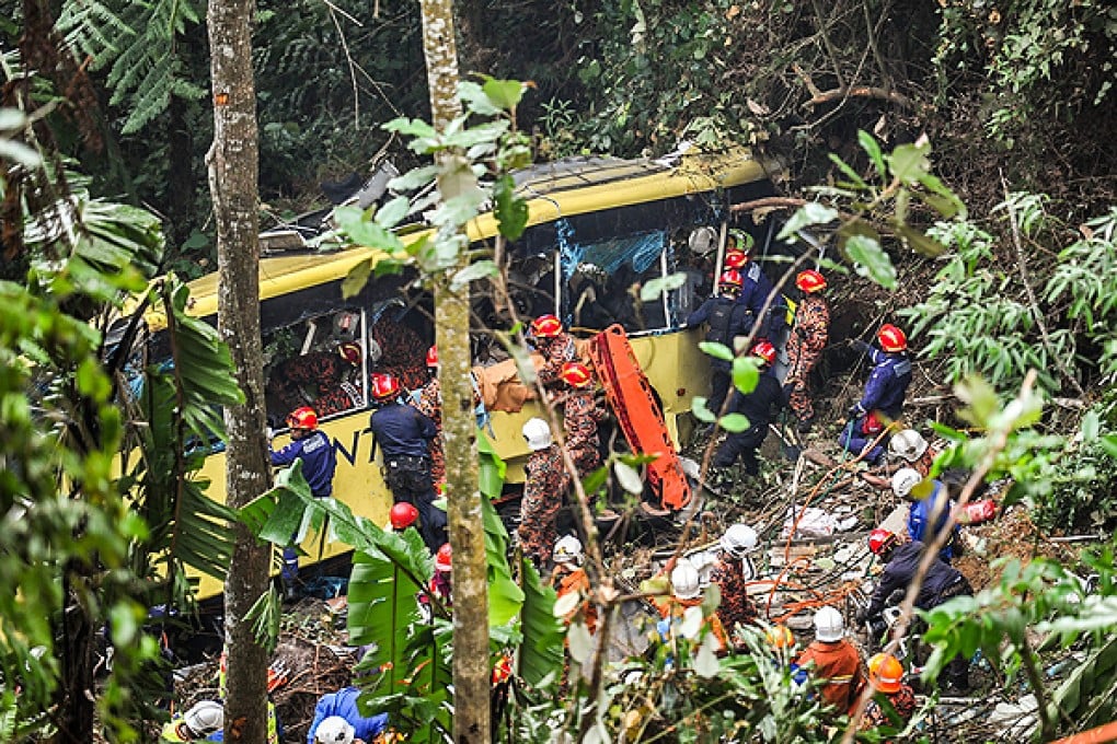Rescuers worker check for survivors at the scene of the crash. Photo: Xinhua