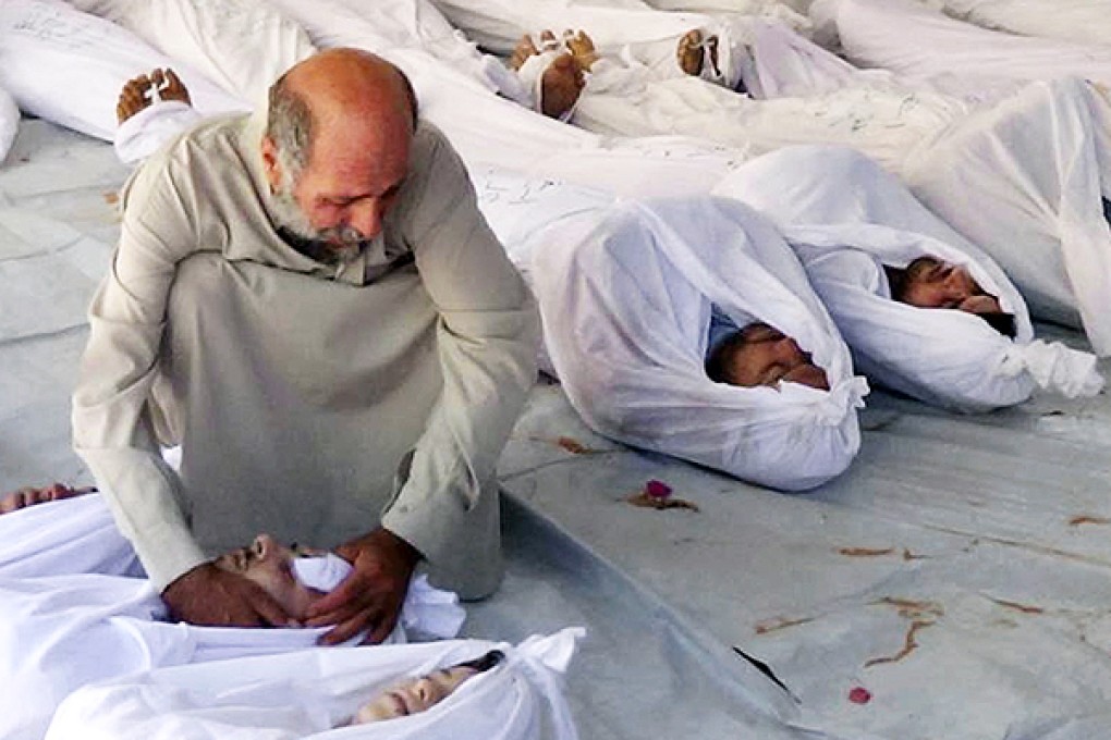 A man mourns a relative killed in an apparent chemical gas attack by Syrian regime forces in Douma town, Damascus. Photo: AP