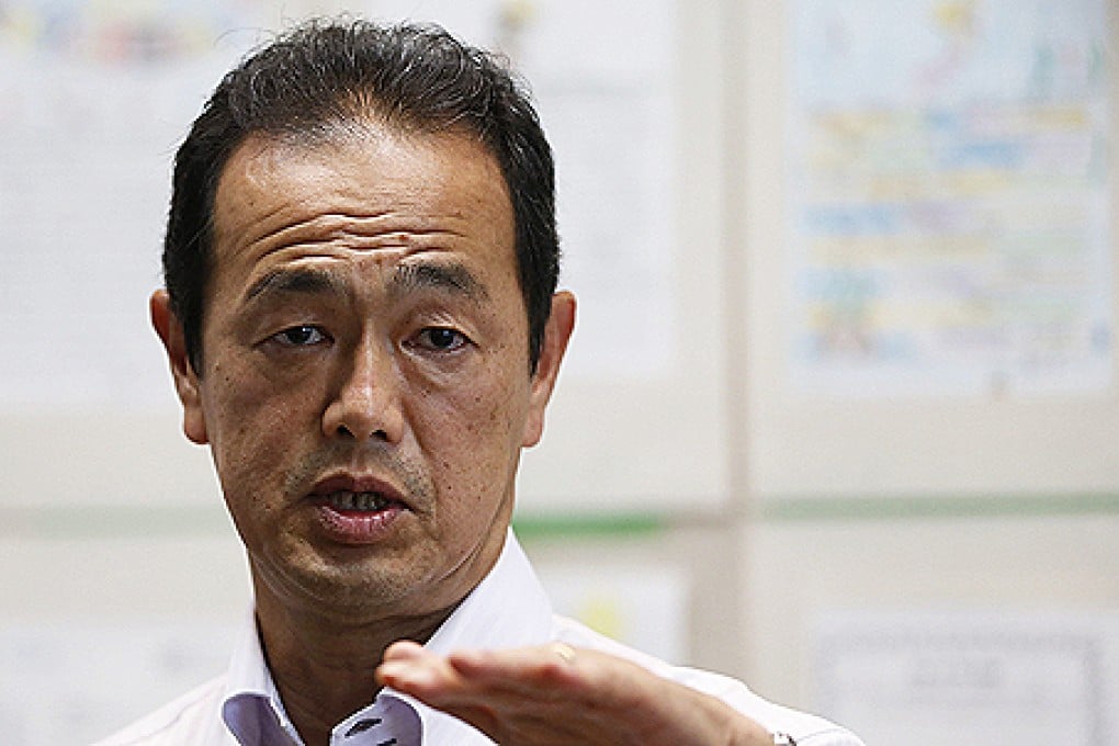 Toyoshi Fuketa of the Nuclear Regulation Authority speaks to the media after his inspection tour of Fukushima nuclear power plant. Photo: Reuters