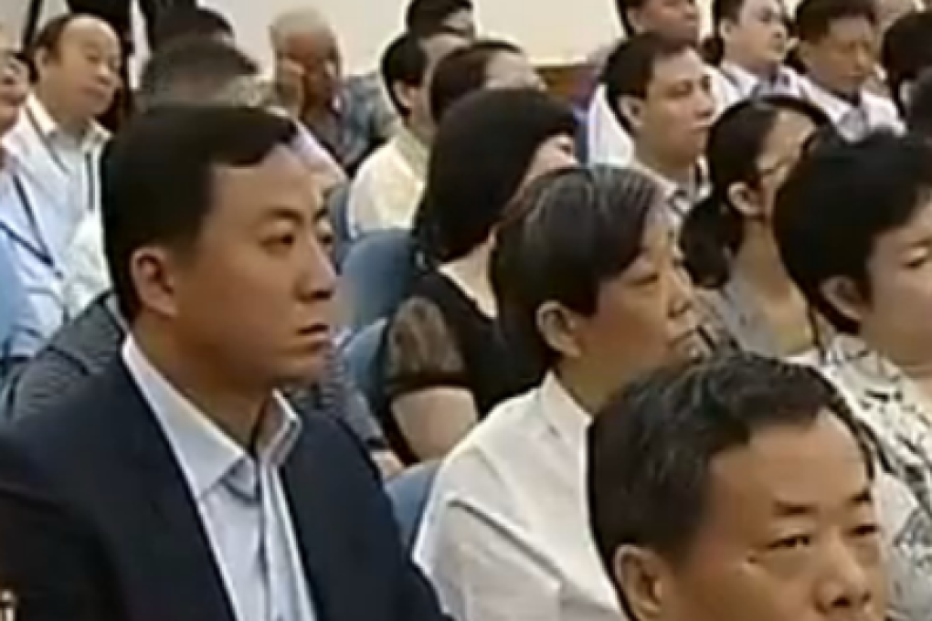 Li Wangzhi, left, Bo Xilai's elder son from his first marriage, seen sitting in the audience of Bo Xilai's trial on August 22. Photo: SCMP Pictures